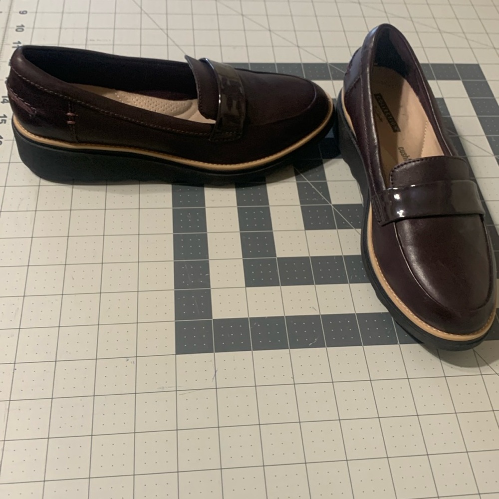 Clarks brown loafers.